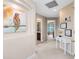 Hallway with carpet flooring and colorful bird art at 449 Cruz Bay Cir, Winter Springs, FL 32708