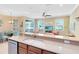 Open floor plan showcasing a spacious kitchen island overlooking the living area with lots of natural light at 449 Cruz Bay Cir, Winter Springs, FL 32708