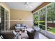 Screened lanai featuring outdoor seating, ceiling fan and views of the backyard at 449 Cruz Bay Cir, Winter Springs, FL 32708