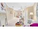 Bright living room with neutral colors, stylish furniture, tile flooring, and archways leading to other rooms at 449 Cruz Bay Cir, Winter Springs, FL 32708