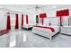 Bright, spacious bedroom with two beds, modern decor, and plenty of natural light at 516 Petes Ln, Davenport, FL 33837