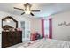 Charming bedroom with decorative furnishings and adjacent bathroom at 516 Petes Ln, Davenport, FL 33837