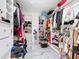 Spacious walk-in closet with built-in shelving, rods, and drawers, perfect for organizing clothes and accessories at 516 Petes Ln, Davenport, FL 33837