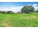 Exterior shot of property with multiple buildings and vehicles and free range chickens at 516 Petes Ln, Davenport, FL 33837