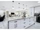 Open kitchen featuring a large island with pendant lighting and views of the living and dining areas at 516 Petes Ln, Davenport, FL 33837
