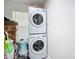 This laundry room has a stackable washer and dryer at 516 Petes Ln, Davenport, FL 33837