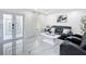 Bright living room boasts marble floors, contemporary furnishings, and lots of natural light at 516 Petes Ln, Davenport, FL 33837