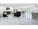 Spacious living room offers an open layout with views of the kitchen, dining area, and backyard at 516 Petes Ln, Davenport, FL 33837