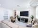 Comfortable living room featuring a modern entertainment center and stylish furniture at 516 Petes Ln, Davenport, FL 33837