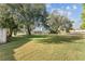 Expansive backyard featuring mature trees and a wooden fence at 7475 Canford Ct # 21, Winter Park, FL 32792