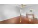 Bedroom showcasing hardwood floors, ceiling fan, and mirrored closet doors at 7475 Canford Ct # 21, Winter Park, FL 32792