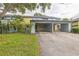 Townhouse with a covered carport, well maintained lawn, and tasteful landscaping at 7475 Canford Ct # 21, Winter Park, FL 32792