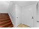 A home entry featuring hardwood staircase and tile floor at 7475 Canford Ct # 21, Winter Park, FL 32792