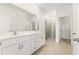 Modern bathroom with double vanity, quartz countertops, and glass-enclosed shower at 797 Lemon Ave, Fruitland Park, FL 34731