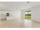Open living space with kitchen and sliding glass doors opening to the outdoors at 797 Lemon Ave, Fruitland Park, FL 34731