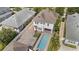 Aerial view of property featuring a backyard pool, driveway, and manicured lawn at 859 Easley Ave, Winter Garden, FL 34787