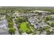Aerial view showcasing a community park featuring mature landscaping, trees, and open green space at 859 Easley Ave, Winter Garden, FL 34787