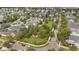 Aerial view showcasing a community park featuring mature landscaping, trees, and open green space at 859 Easley Ave, Winter Garden, FL 34787