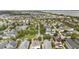 Aerial view showcasing community with mature trees, landscaping, and variety of residential architecture at 859 Easley Ave, Winter Garden, FL 34787