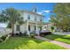 Charming two-story home with a welcoming front porch, lush lawn and well-manicured landscaping at 859 Easley Ave, Winter Garden, FL 34787