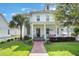 Charming two-story home with a welcoming front porch, lush lawn and well-manicured landscaping at 859 Easley Ave, Winter Garden, FL 34787