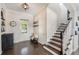 Inviting foyer with hardwood floors, a staircase, and a front door at 859 Easley Ave, Winter Garden, FL 34787