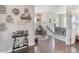 Upstairs hallway featuring hardwood floors, modern lighting, and decorative wall art at 859 Easley Ave, Winter Garden, FL 34787