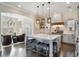 Open kitchen with an island and barstool seating, seamlessly connected to the sitting area at 859 Easley Ave, Winter Garden, FL 34787