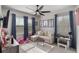 Comfortable living room featuring a plush sectional sofa, large windows, and stylish decor at 859 Easley Ave, Winter Garden, FL 34787