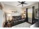 Comfortable living room with leather seating, a large window, and custom airplane artwork at 859 Easley Ave, Winter Garden, FL 34787