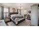 Charming main bedroom with hardwood floors, soft natural light and a decorative chandelier at 859 Easley Ave, Winter Garden, FL 34787