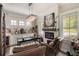 Office area with brick wall, decorative lighting, and a large desk at 859 Easley Ave, Winter Garden, FL 34787