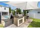 Outdoor kitchen with a built-in grill and bar seating, perfect for entertaining near the pool at 859 Easley Ave, Winter Garden, FL 34787