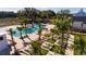 Resort-style pool and lounge area with palm trees offers a luxurious outdoor experience for residents at 859 Easley Ave, Winter Garden, FL 34787