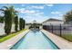 Beautiful backyard pool with mature landscaping, string lights, and a sunshade at 859 Easley Ave, Winter Garden, FL 34787