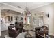 Sitting room with leather chairs, a chandelier, and access to other parts of the home at 859 Easley Ave, Winter Garden, FL 34787