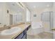 Bright bathroom features a soaking tub, shower, and a large vanity with ample counter space at 8622 La Isla Dr, Kissimmee, FL 34747