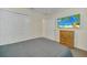 Relaxing bedroom with double closet and a mounted TV for easy viewing at 8622 La Isla Dr, Kissimmee, FL 34747