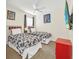 Charming bedroom with twin beds, vibrant décor, and a ceiling fan at 8622 La Isla Dr, Kissimmee, FL 34747