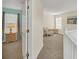 Open view to sitting room with new carpet at 8622 La Isla Dr, Kissimmee, FL 34747