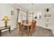 Elegant dining area with a wooden table and chairs, bathed in natural light at 8622 La Isla Dr, Kissimmee, FL 34747
