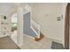 Bright and airy foyer with tile flooring and a staircase leading to the upper level at 8622 La Isla Dr, Kissimmee, FL 34747