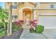 Inviting front entrance with decorative plants and a well-maintained walkway at 8622 La Isla Dr, Kissimmee, FL 34747