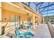 Outdoor lanai with pool views, lounge chair, and shaded dining area at 8622 La Isla Dr, Kissimmee, FL 34747