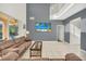 This open living room features high ceilings and sliding doors to a screened patio at 8622 La Isla Dr, Kissimmee, FL 34747