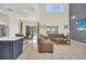 Bright living room with vaulted ceilings, tile floors, and sliding door access to the backyard at 8622 La Isla Dr, Kissimmee, FL 34747