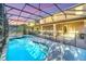 Relax and enjoy the outdoors with this screened-in pool and patio, creating a perfect oasis for leisure and entertaining at 8622 La Isla Dr, Kissimmee, FL 34747