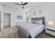 Comfortable bedroom with a soft bed, neutral decor, and a television, offering a relaxing space at 9227 Sommerset Hills Dr, Davenport, FL 33896