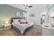 Comfortable bedroom with a plush bed, soft lighting, and ensuite bathroom, offering a relaxing retreat at 9227 Sommerset Hills Dr, Davenport, FL 33896