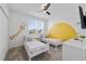Well-lit ' bedroom showcasing twin beds, cute wall decals, and a ceiling fan at 9227 Sommerset Hills Dr, Davenport, FL 33896